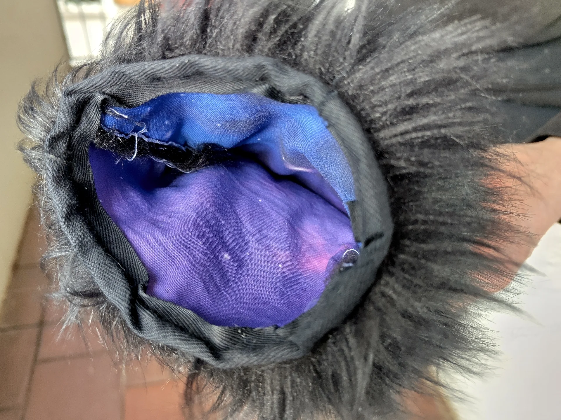 Inside view of the sewn paw pads with blue/purple cotton lining.